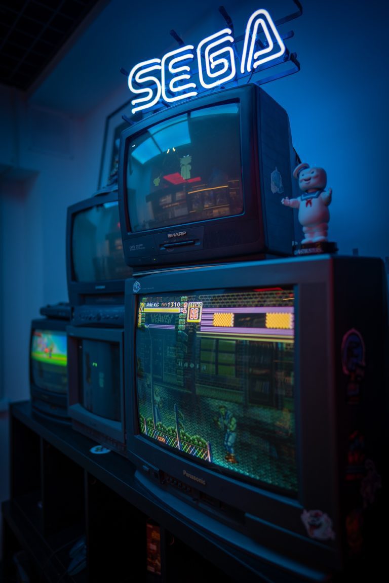 old TVs playing retro SEGA games